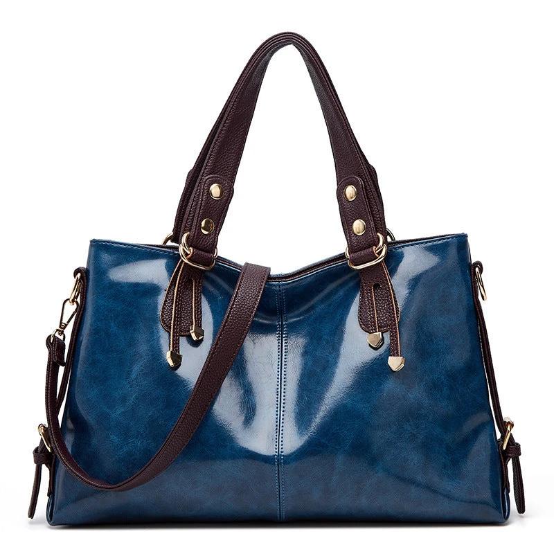 Large capacity women's soft leather shoulder messenger handbag by Ancient Energy with multiple compartments and adjustable strap.