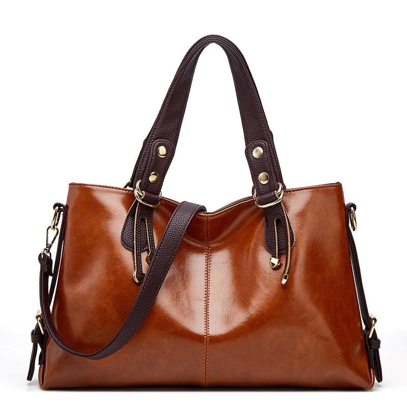 Large soft leather women's shoulder messenger handbag by Ancient Energy with spacious interior and adjustable strap.