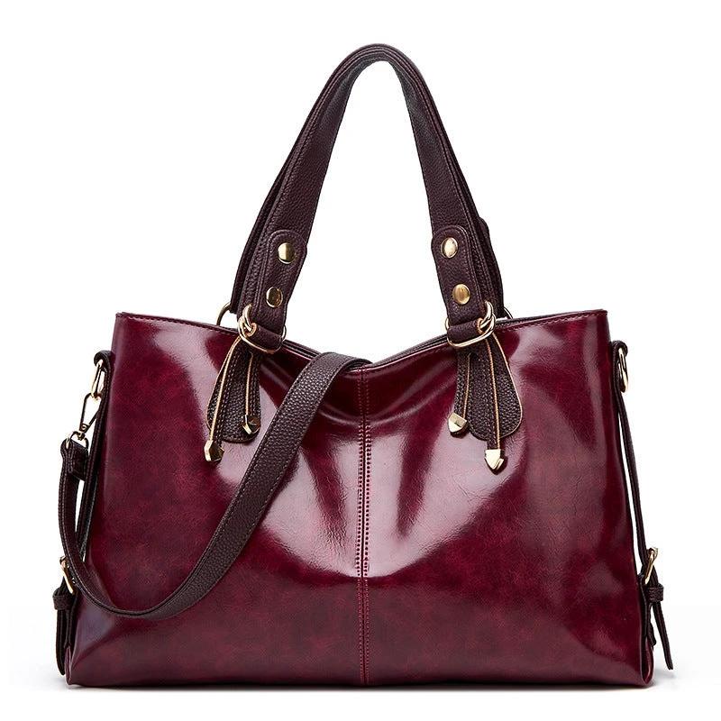 Women's large capacity soft leather shoulder messenger handbag by Ancient Energy, featuring a spacious design and elegant style.