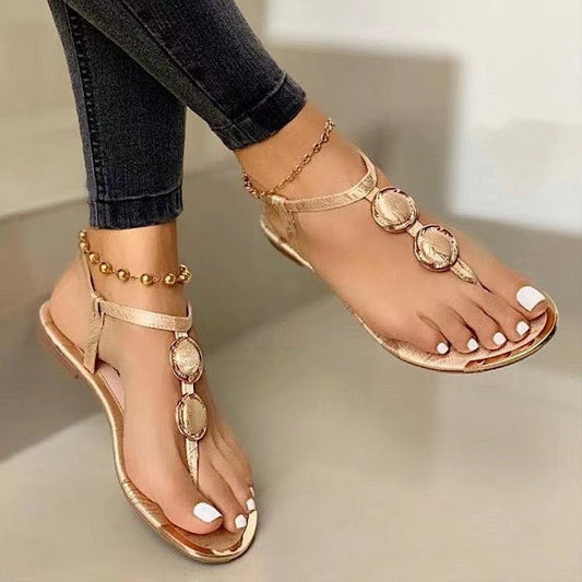 Women’s summer casual flat thong beach sandals by Ancient Energy, featuring comfortable design and neutral color.