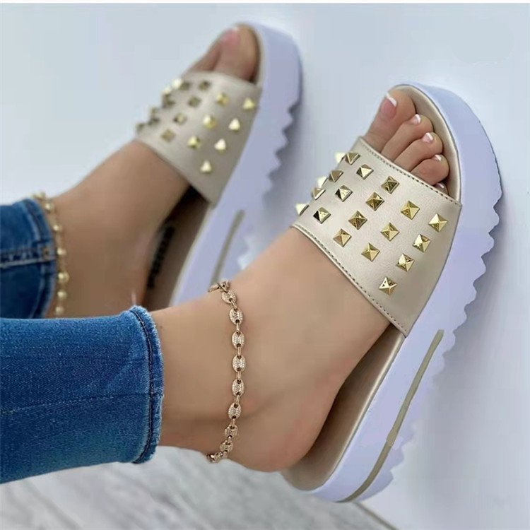 Women's wedge and rivet beach flip-flops by Ancient Energy with comfortable straps and stylish design for summer wear.