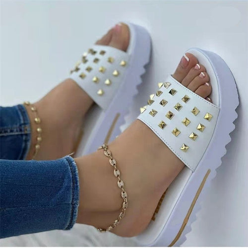Women's wedge and rivet beach flip-flops by Ancient Energy, featuring comfortable footbed and stylish design for summer wear.