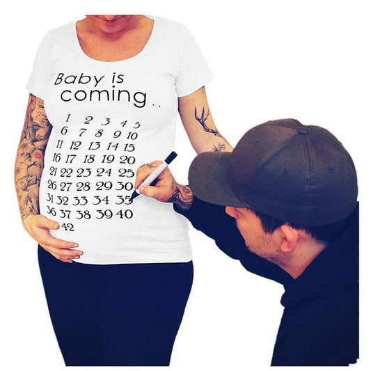 Women’s slim maternity T-shirt by Ancient Energy featuring a fun letter design and O-neck style for pregnant women.