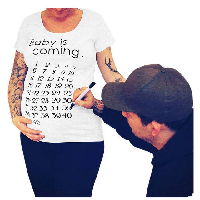 Women’s slim maternity T-shirt by Ancient Energy featuring a fun letter design and O-neck style for pregnant women.