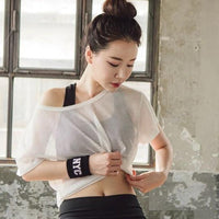 Ancient Energy women's yoga shirt with hollow-out mesh design, breathable crop top for running, fitness, and gym workouts.