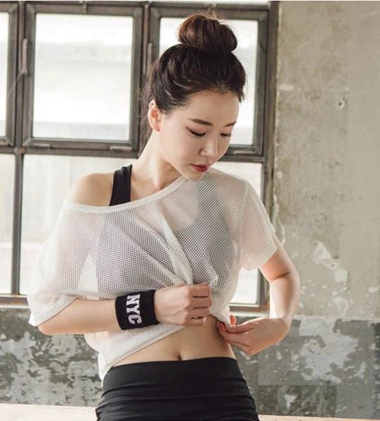 Women’s breathable yoga shirt by Ancient Energy featuring a hollow-out mesh design, crop top style, ideal for running and fitness.