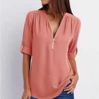 Ancient Energy women's short sleeve zip V-neck shirt with a loose fit, casual and comfortable for everyday wear.