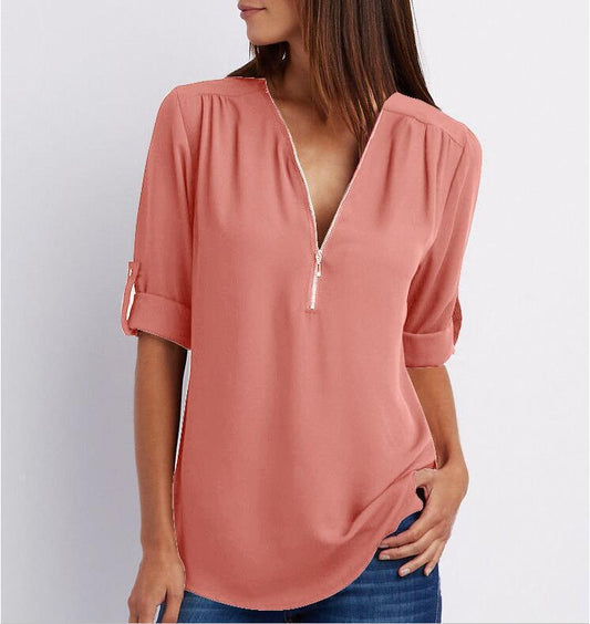 Ancient Energy women's short sleeve zip V-neck shirt with a loose fit, casual and comfortable for everyday wear.