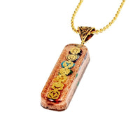 7 chakra orgone copper pendant with chain from Ancient Energy, featuring colorful chakra stones and intricate metalwork.
