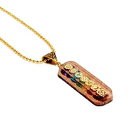 7 chakra Orgone Copper Pendant with chain from Ancient Energy, featuring colorful chakra stones and intricate copper design.