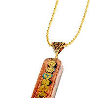 7 chakra Orgone copper pendant with chain from Ancient Energy, featuring colorful chakra stones and detailed copper design.