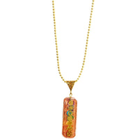 Seven chakra orgone copper pendant with chain, featuring colorful chakra symbols and a polished finish, designed for energy balancing.
