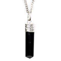 Silver-plated Black Tourmaline Protection Pendant from Ancient Energy, featuring a polished black stone on a sleek silver chain.