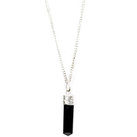 Silver-plated Black Tourmaline Protection Pendant from Ancient Energy, showcasing a polished black tourmaline stone on a silver chain.