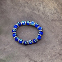 Ancient Energy Evil Eye Protection Bracelet with blue and white beads, designed to ward off negative energy.
