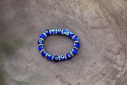 Ancient Energy Evil Eye Protection Bracelet with blue and white beads, designed to ward off negative energy.