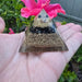 Mini orgone protection pyramid made of brass, copper, and black tourmaline by Ancient Energy, with a sleek black finish and intricate design.