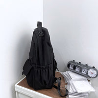 Ancient Energy nylon school backpack with adjustable straps and multiple compartments for junior high students.