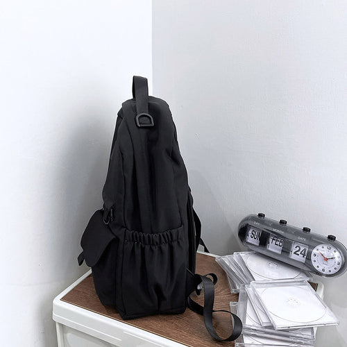 Ancient Energy nylon school backpack with adjustable straps and multiple compartments for junior high students.