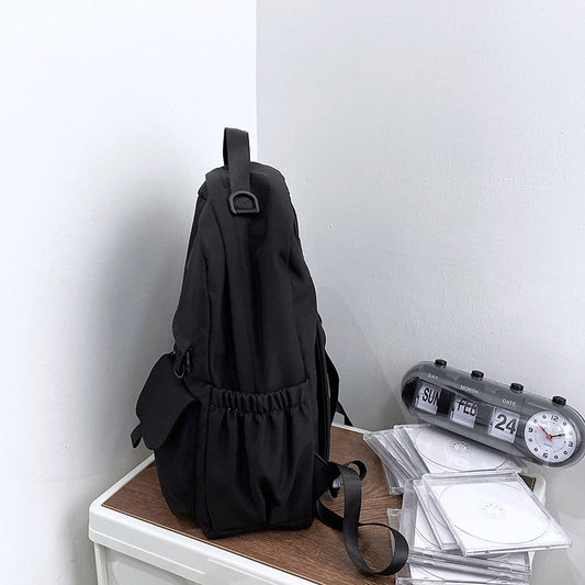 Ancient Energy nylon school backpack with adjustable straps and multiple compartments for junior high students.
