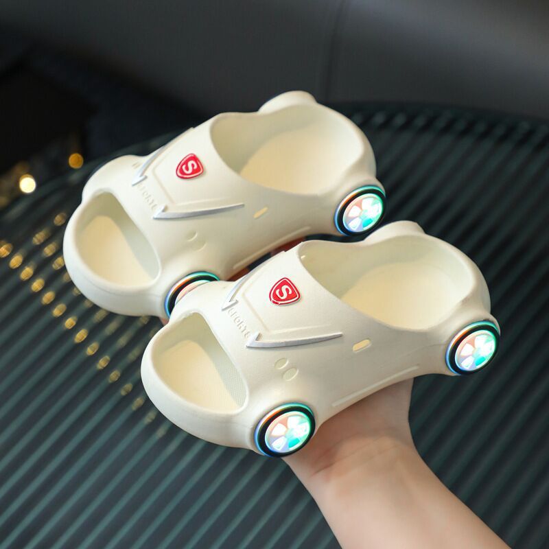 Kids glowing cartoon car slippers by Ancient Energy, luminous slip-on sandals with anti-slip soles, perfect for summer beach fun.