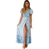 Mandotos International Tropical Bloom Maxi Dress featuring vibrant floral patterns and flowing fabric for warm-weather wear.