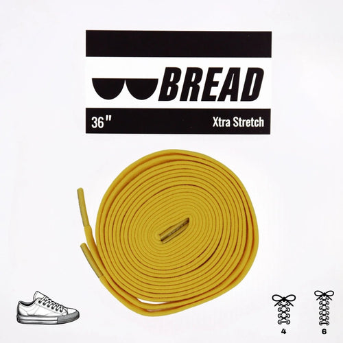 Elastic shoelace in vibrant yellow from Bread, designed for easy slip-on comfort and secure fit.