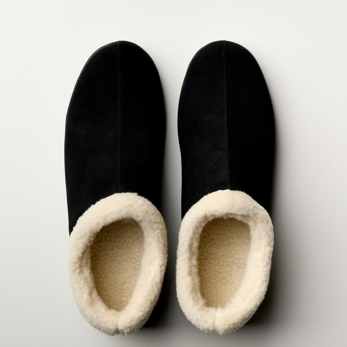 Cozy women's suede slippers from Bread's Ashton Edition with plush lining and slip-on design for comfortable indoor wear.