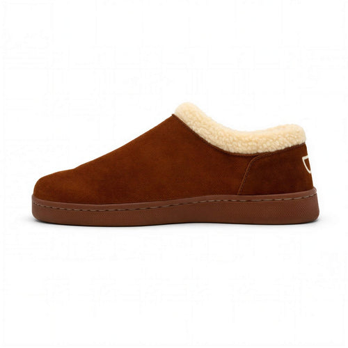 Men's Bread Ashton suede slippers resting on a wooden surface, featuring soft suede material and a cozy design.