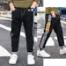 Kids' casual straight pants by Ancient Energy with a comfortable fit, featuring a simple design in neutral fabric.