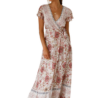 Mandotos International Tropical Bloom Maxi Dress featuring vibrant floral patterns and flowing fabric, perfect for summer wear.