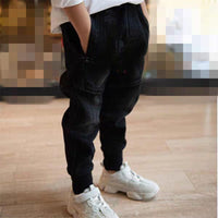 Kids black jeans by Ancient Energy, single spring and autumn boys' pants, shown on a child, casual and comfortable fit.