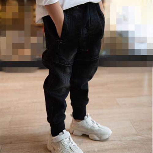 Kids black jeans by Ancient Energy, single spring and autumn boys' pants, shown on a child, casual and comfortable fit.