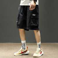 Men's cargo shorts with multiple pockets, lightweight summer pants by Ancient Energy, featuring a relaxed fit and casual style.