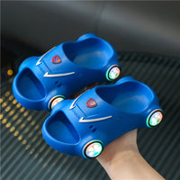 Kids glowing cartoon car slippers by Ancient Energy, luminous children's slip-on sandals with anti-slip soles for summer beach fun.