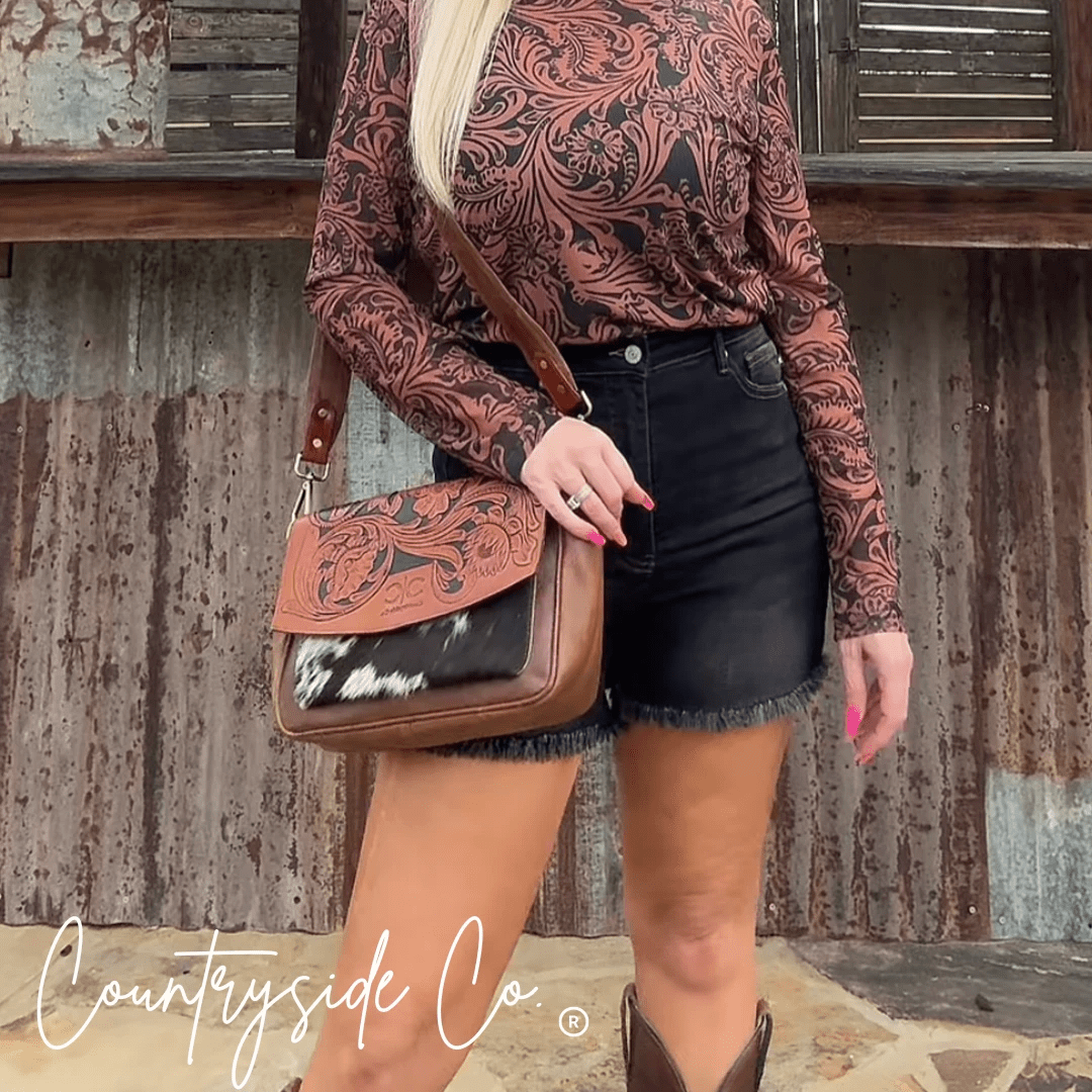 Grace Tooled Leather Purse by Countryside Co., featuring intricate tooling and a classic design, shown in a close-up view.