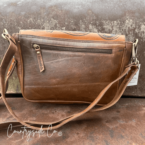Grace Tooled Leather Purse by Countryside Co. featuring detailed embossed leather, compact size, and antique finish.