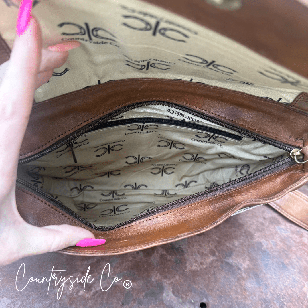 Grace Tooled Leather Purse by Countryside Co. featuring intricate tooling and a classic design, shown in a close-up view.
