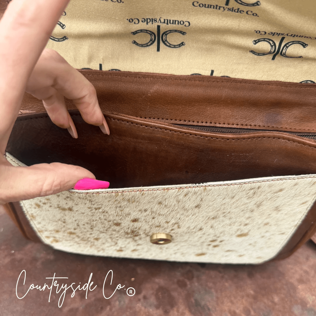 Grace Tooled Leather Purse by Countryside Co. featuring intricate tooling, a compact design, and a stylish leather finish.