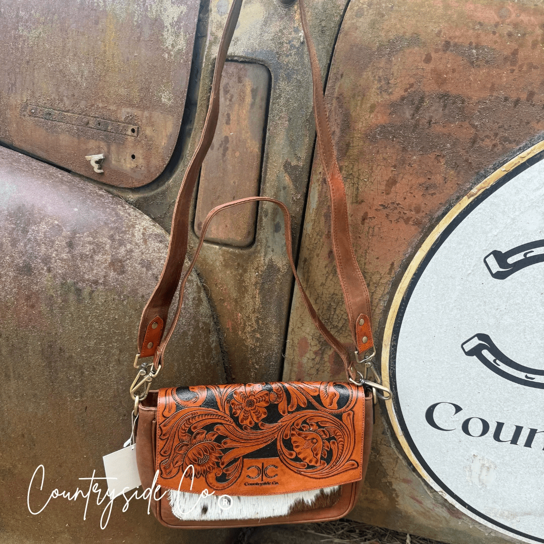 Grace Tooled Leather Purse by Countryside Co. featuring detailed tooling and a classic design, shown in a close-up view.