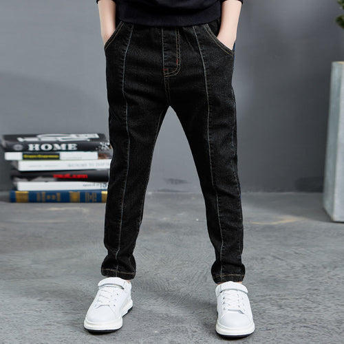 Boy wearing navy velvet one-piece jeans for autumn and winter by Ancient Energy, featuring a comfortable, stylish design.