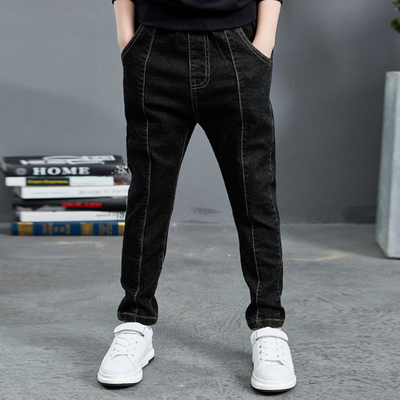 Boy wearing navy velvet one-piece jeans for autumn and winter by Ancient Energy, featuring a comfortable, stylish design.