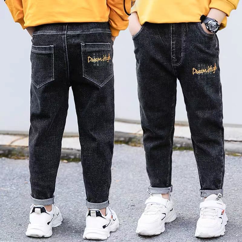 Boy wearing Ancient Energy velvet winter and autumn jeans, one-piece with cozy fabric, suitable for cold weather.