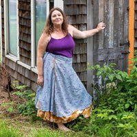 Colorful sari wrap skirt from Darn Good Yarn featuring vibrant patterns and flowing fabric, styled as a versatile clothing accessory.