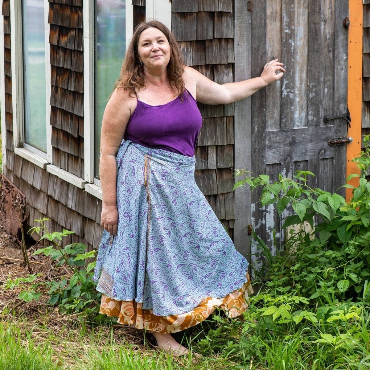 Colorful sari wrap skirt from Darn Good Yarn featuring vibrant patterns and flowing fabric, styled as a versatile clothing accessory.