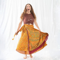 Colorful sari wrap skirt by Darn Good Yarn featuring vibrant patterns and flowing fabric, perfect for boho or casual wear.
