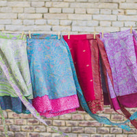 Colorful sari wrap skirt by Darn Good Yarn, showcasing vibrant fabric and flowing design in a clothing and accessories image.
