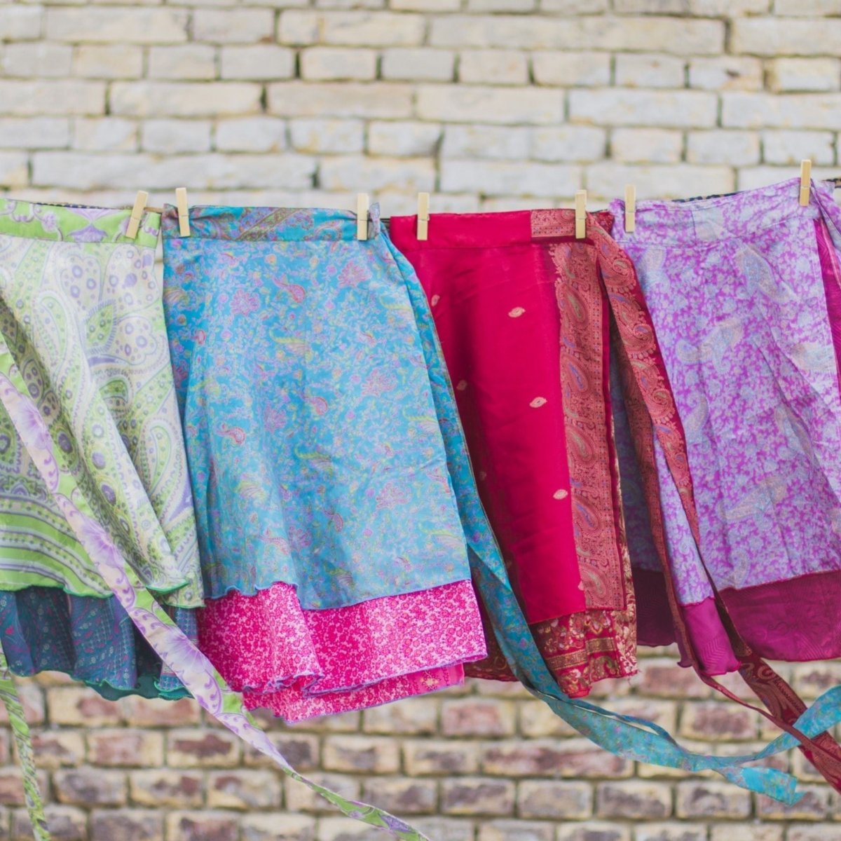 Colorful sari wrap skirt by Darn Good Yarn, showcasing vibrant fabric and flowing design in a clothing and accessories image.