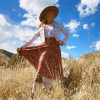 Colorful sari wrap skirt by Darn Good Yarn, featuring vibrant fabric and traditional wrap design, perfect for casual or bohemian style.