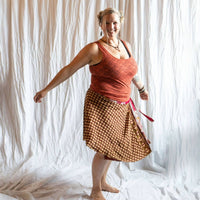 Darn Good Yarn The Original Sari Wrap Skirt in vibrant fabric, styled as a bohemian clothing accessory with intricate patterns.